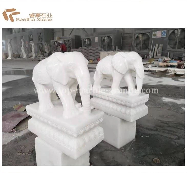 white stone elephant sculptures